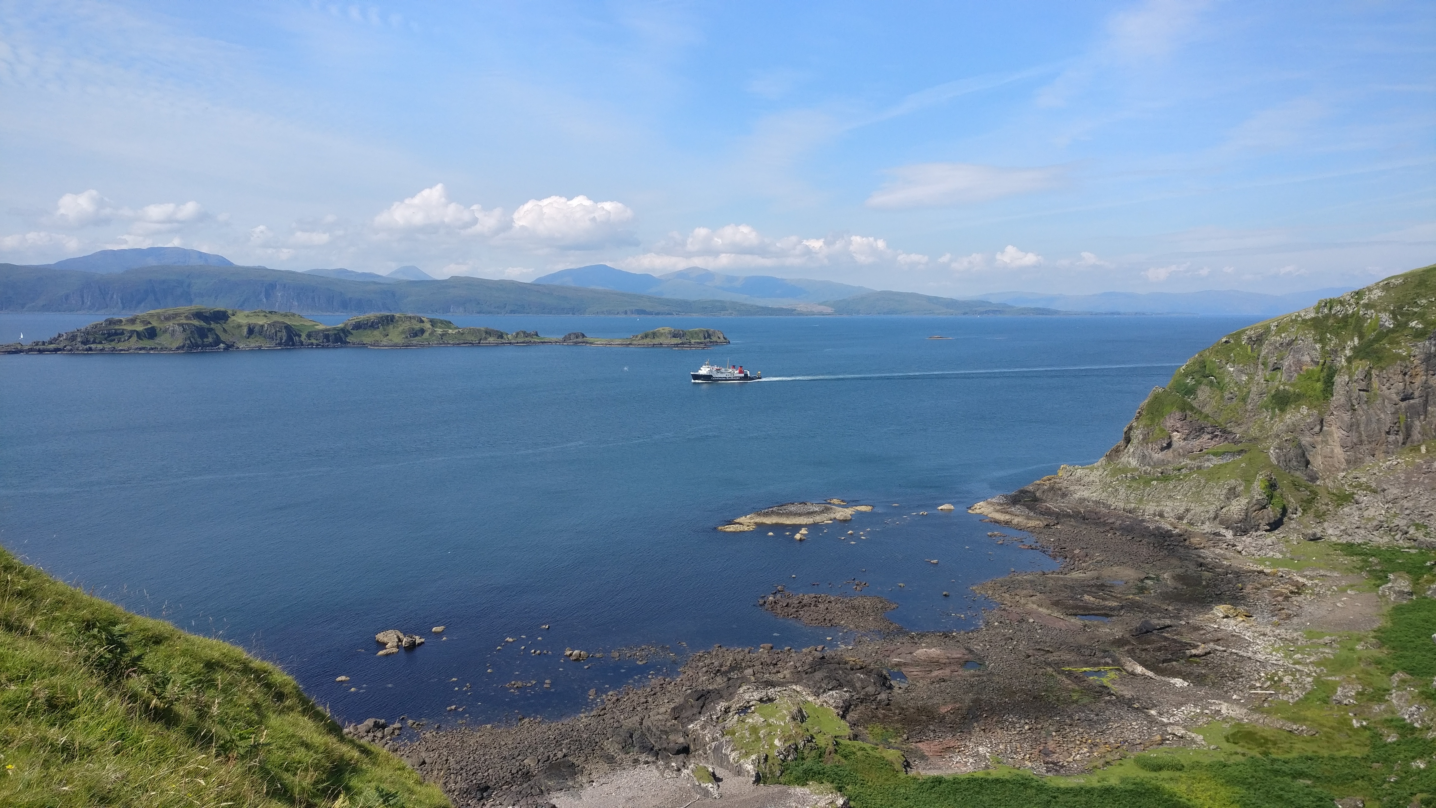 Image showing Caledonian MacBrayne ferry passing a small island