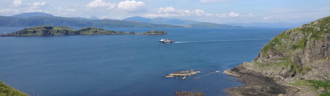 Image showing Caledonian MacBrayne ferry passing a small island